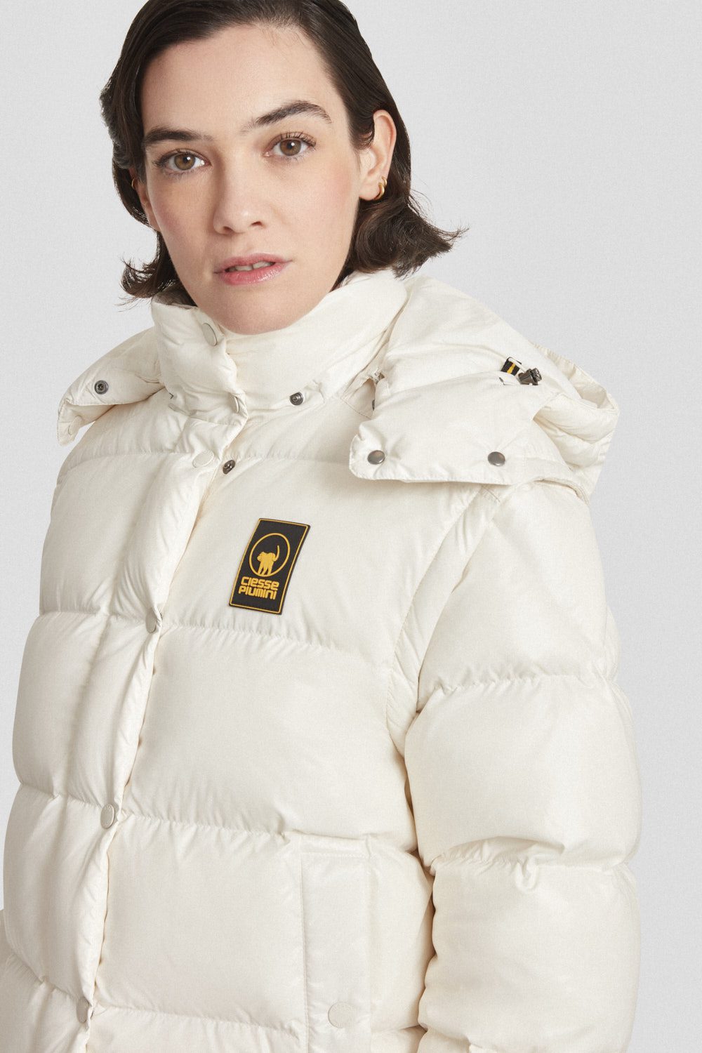 Piumino Ciesse trapuntato bianco con cappuccio e maniche staccabili