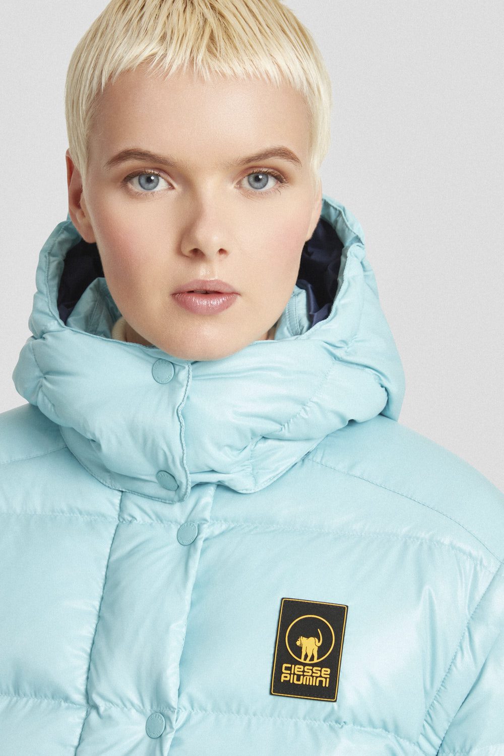 Piumino Ciesse trapuntato azzurro con cappuccio e maniche staccabili