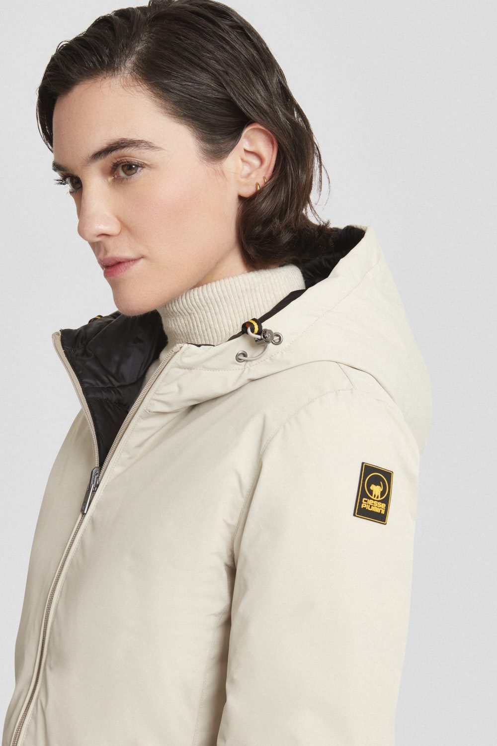 Piumino Ciesse reversibile beige/nero con cappuccio